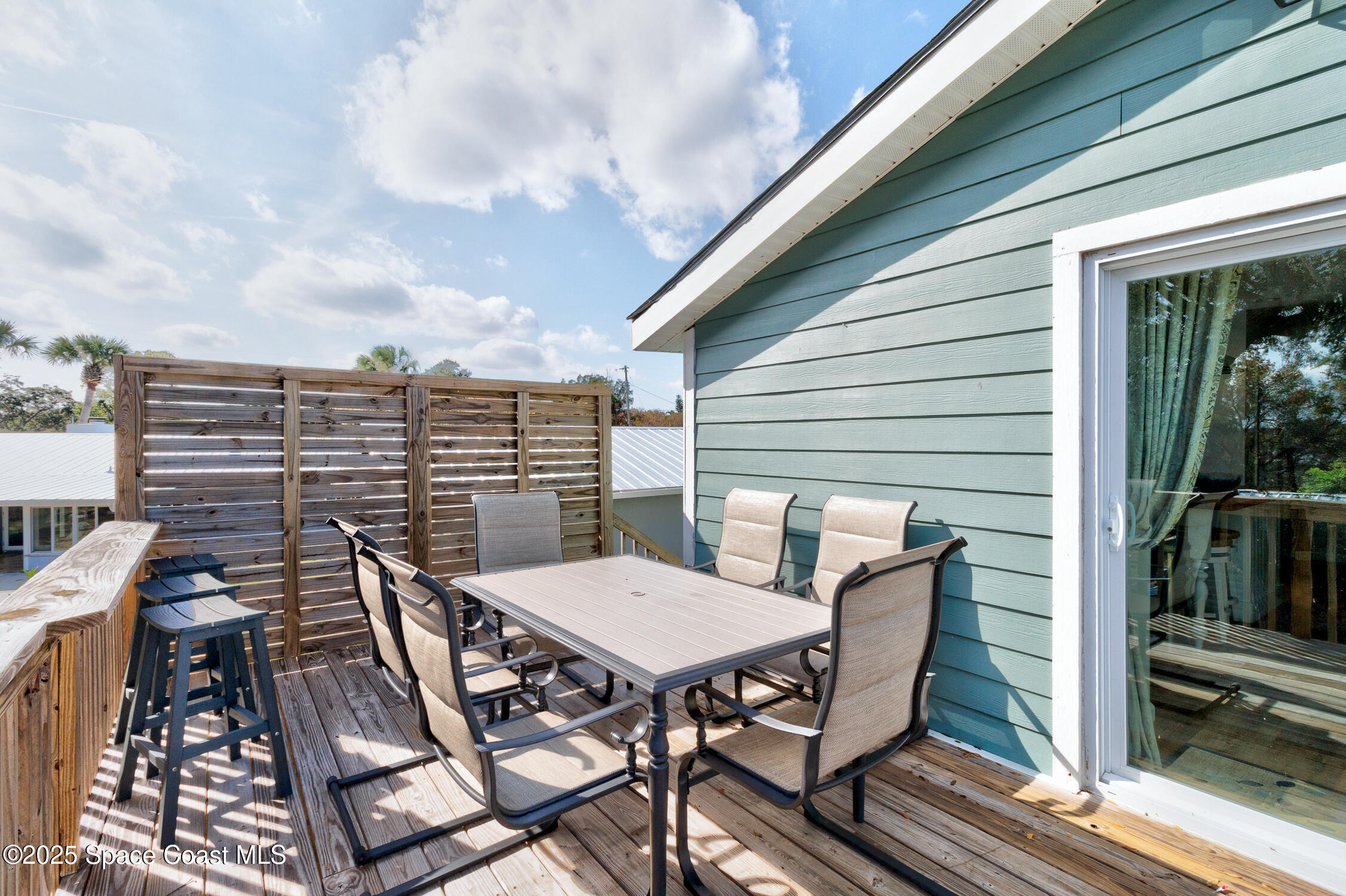 4055 Palm Avenue Micco, FL 32976 - Photo 44 of 58 a balcony with table and chairs