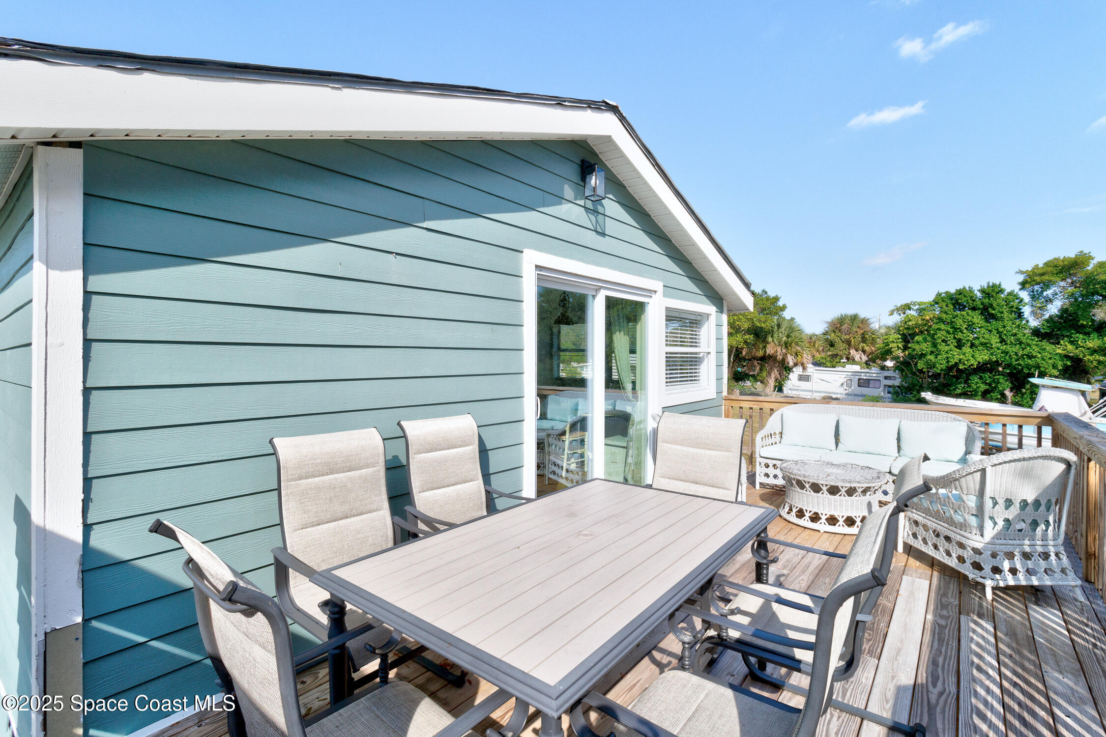 4055 Palm Avenue Micco, FL 32976 - Photo 45 of 58 a view of a patio with table and chairs