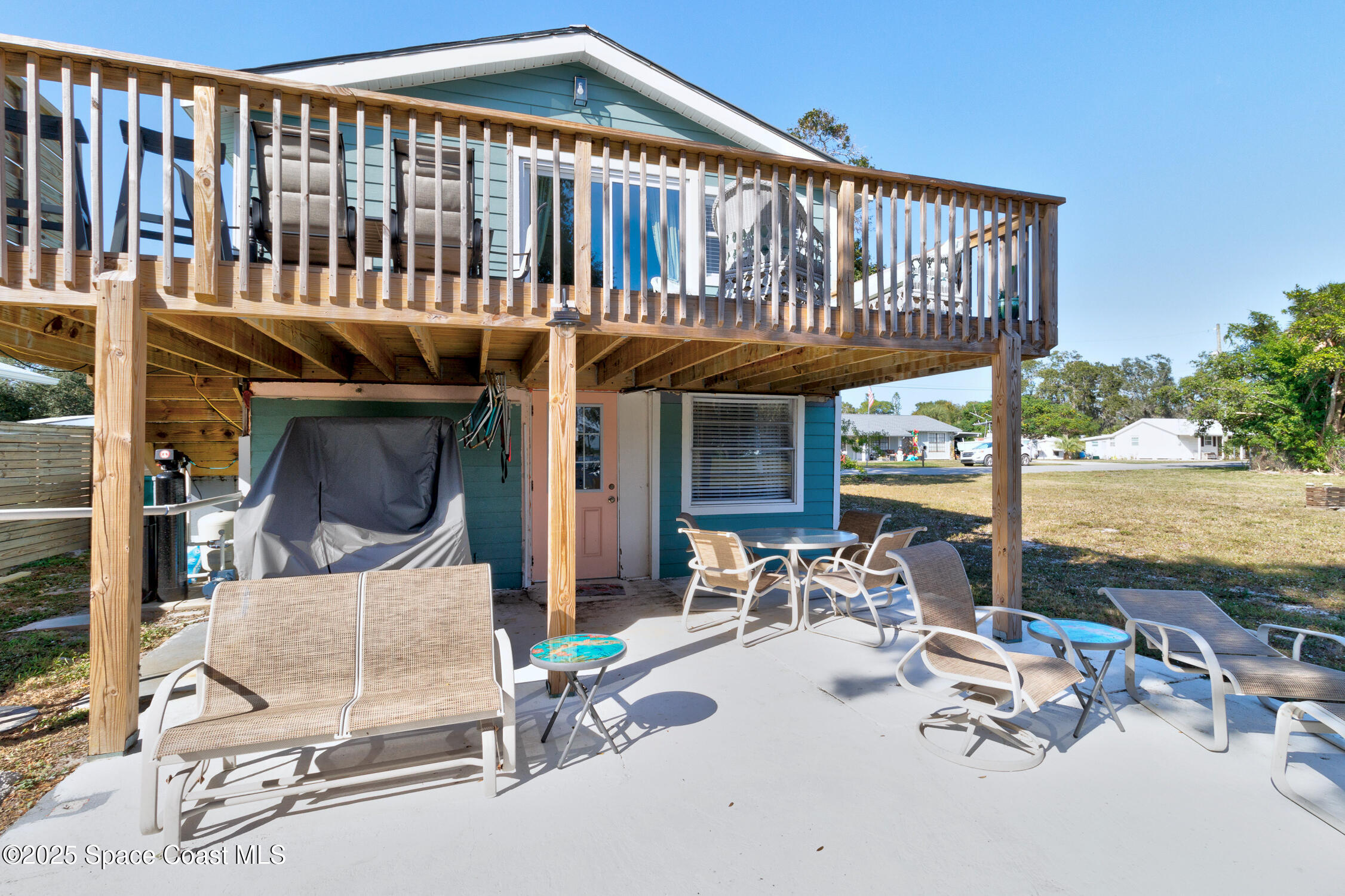 4055 Palm Avenue Micco, FL 32976 - Photo 50 of 58 a view of a chairs and table in the balcony