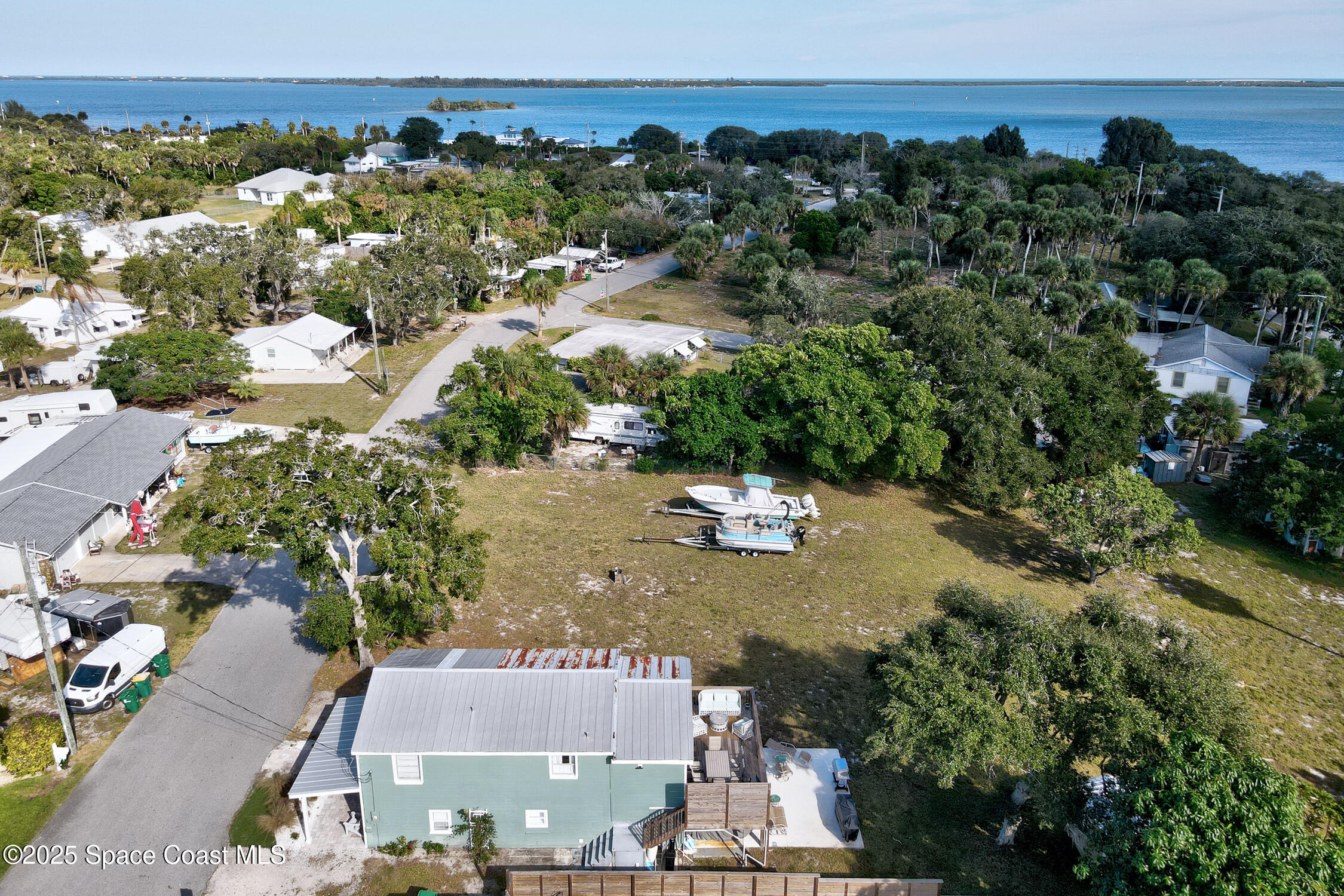 4055 Palm Avenue Micco, FL 32976 - Photo 58 of 58 an aerial view of a house with a yard