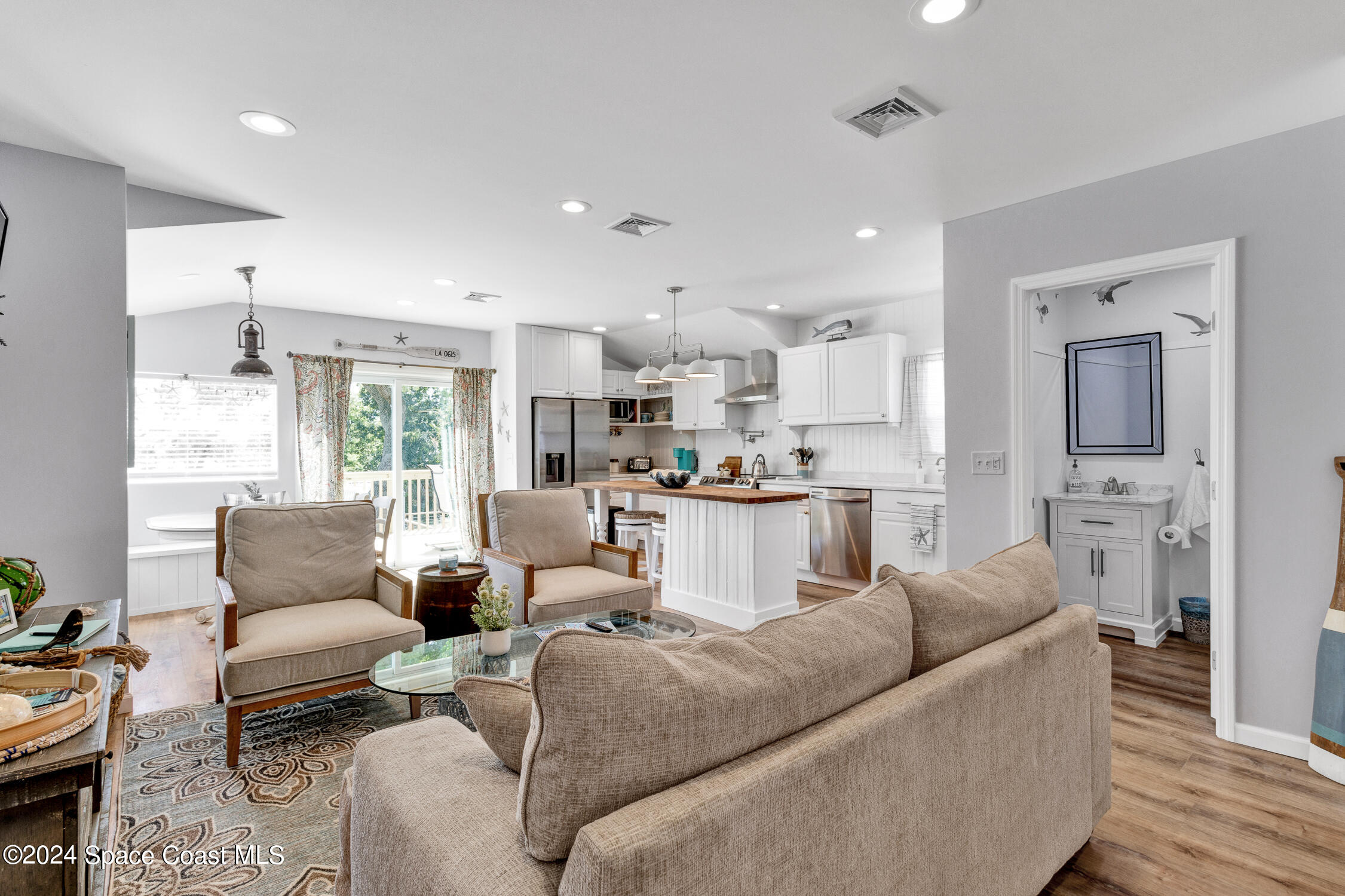 4055 Palm Avenue Micco, FL 32976 - Photo 6 of 58 a living room with furniture and a large window