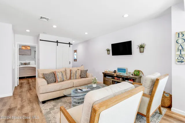 a kitchen with a stove a sink a refrigerator and cabinets
