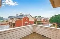 a view of a balcony and front door