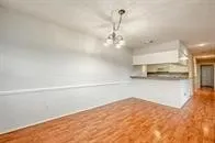a view of a refrigerator in kitchen and a window