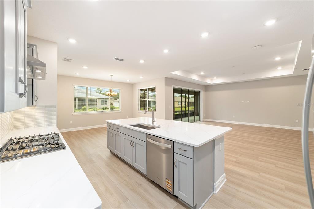 10305 Southwest 105th Street Ocala, FL 34481 - Photo 22 of 44 a large white kitchen with a large window