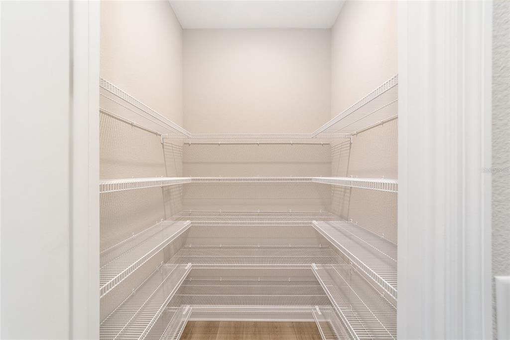 10305 Southwest 105th Street Ocala, FL 34481 - Photo 23 of 44 a view of a walk in closet with empty racks