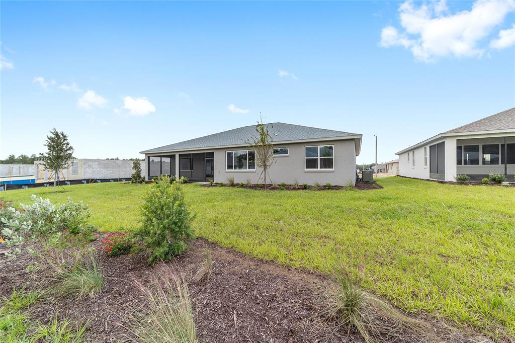 10305 Southwest 105th Street Ocala, FL 34481 - Photo 44 of 44 a front view of house with yard and green space