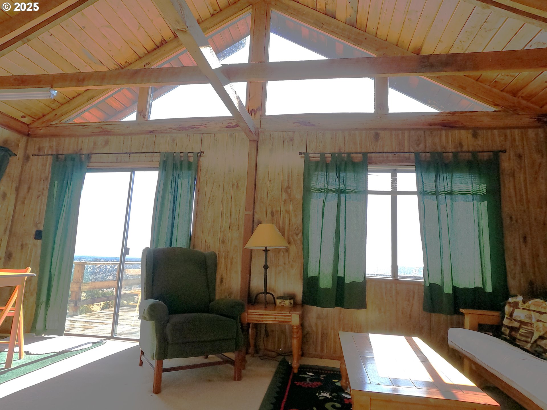 11195 Southwest Yucca Flats Lane Culver, OR 97734 - Photo 12 of 25 a living room with furniture and a large window