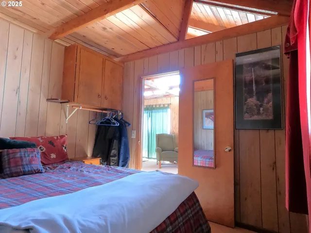 a bedroom with a bed and a closet