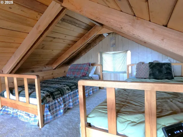 a view of living room kitchen and entryway