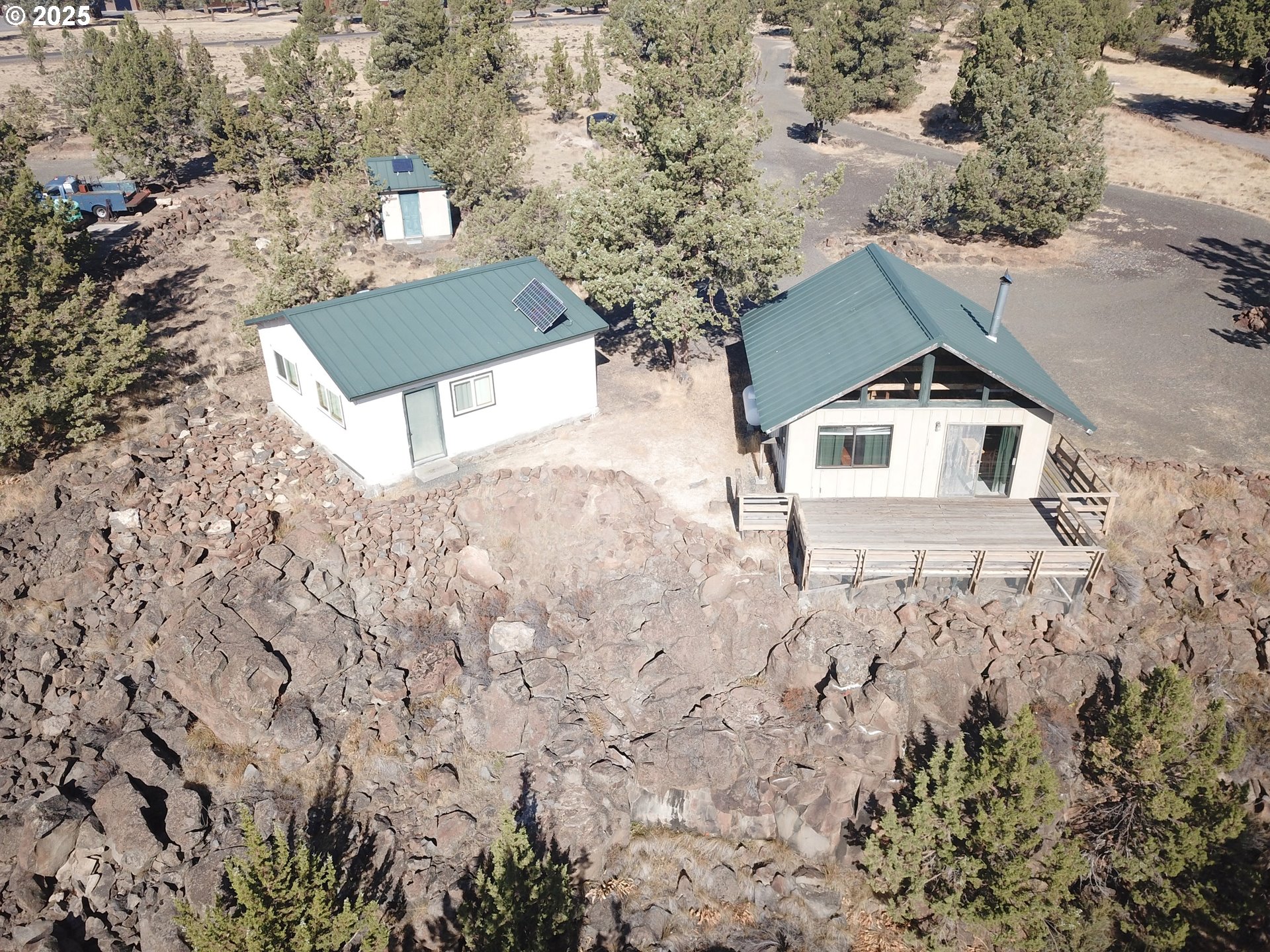 11195 Southwest Yucca Flats Lane Culver, OR 97734 - Photo 2 of 25 a view of a house with a yard and wooden fence