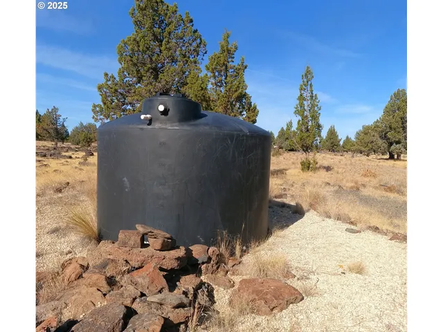 a view of a backyard of the house