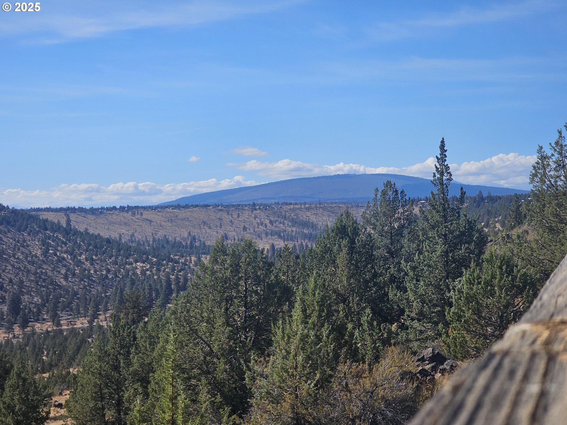 11195 Southwest Yucca Flats Lane Culver, OR 97734 - Photo 4 of 25 a view of a lake with a mountain in the background
