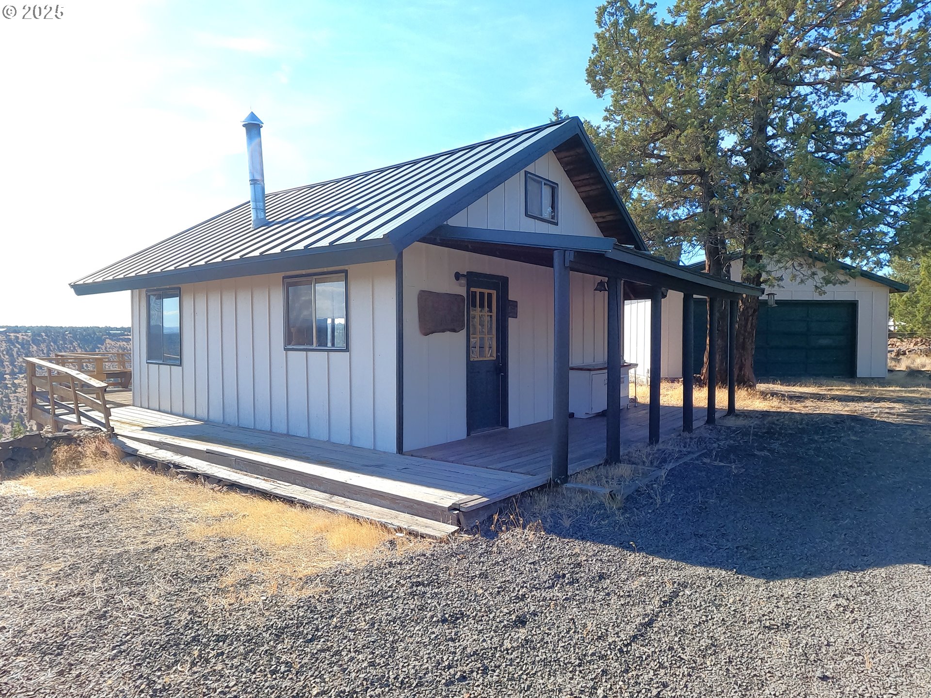 11195 Southwest Yucca Flats Lane Culver, OR 97734 - Photo 7 of 25 a front view of a house with a yard