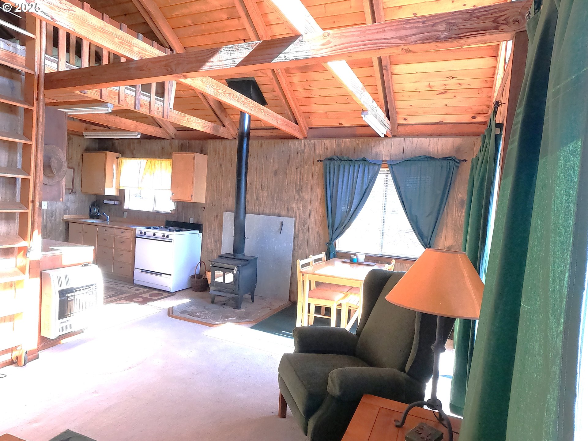 11195 Southwest Yucca Flats Lane Culver, OR 97734 - Photo 10 of 25 a living room with furniture and a window
