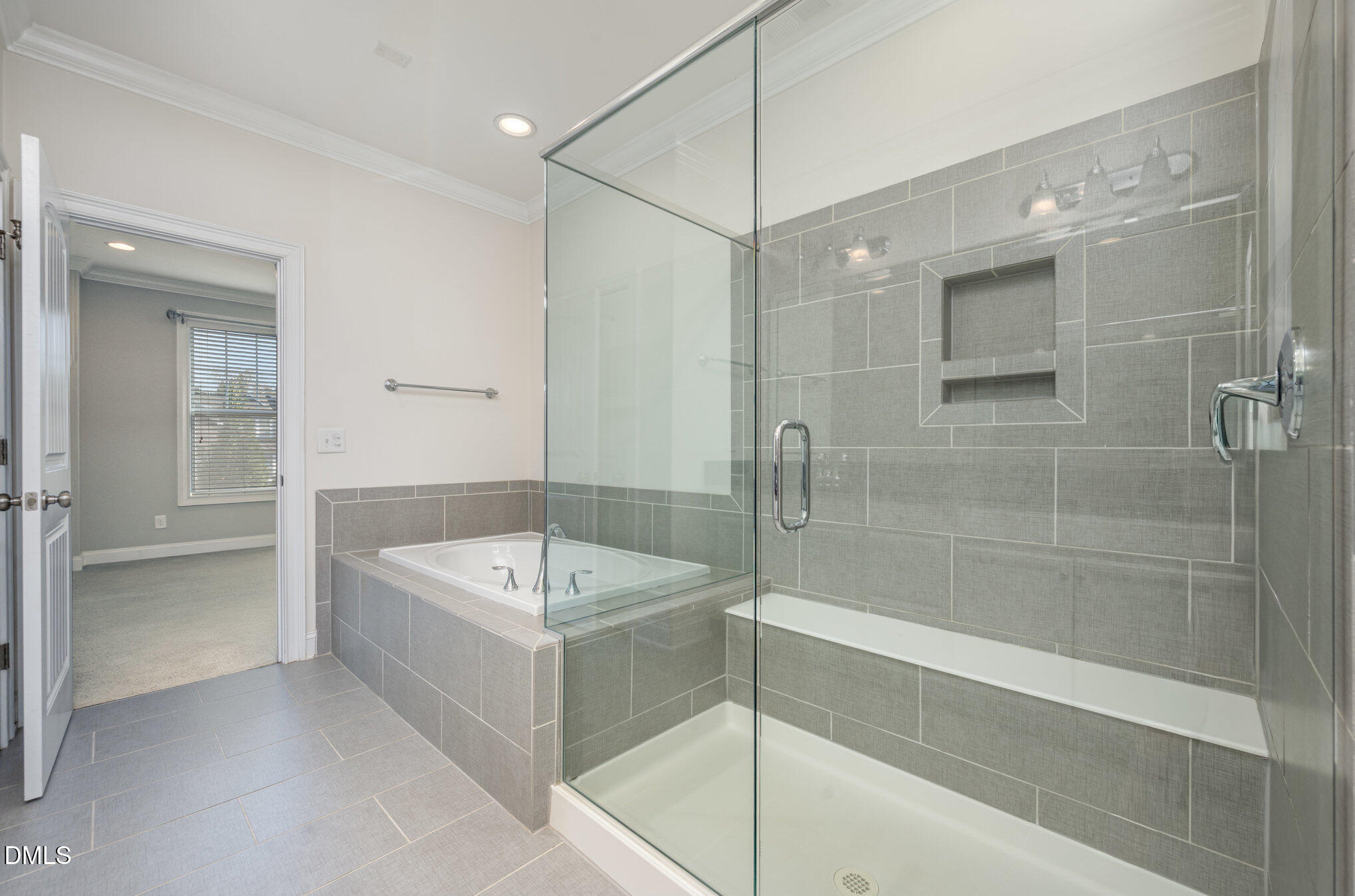 708 Fallon Grove Way Raleigh, NC 27608 - Photo 16 of 27 a bathroom with a tub a sink shower and mirror