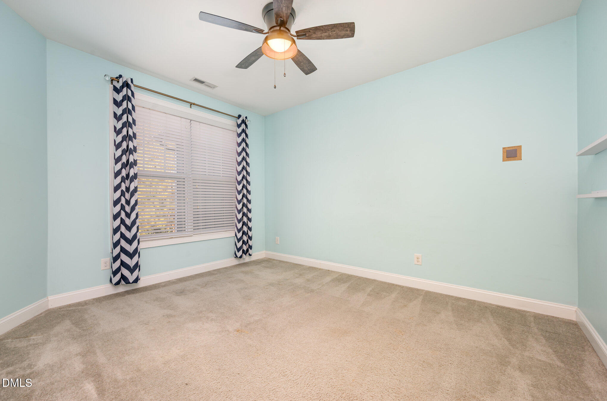 708 Fallon Grove Way Raleigh, NC 27608 - Photo 18 of 27 an empty room with windows and fan
