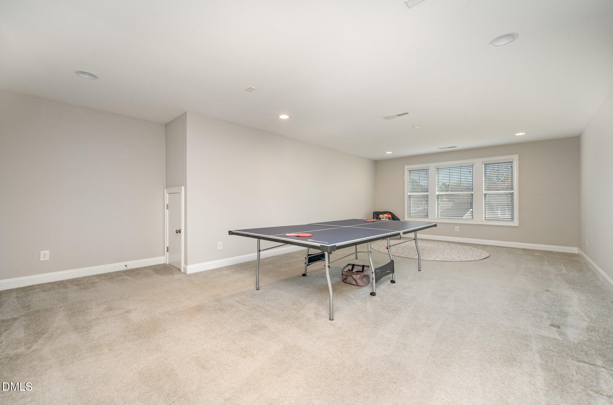 708 Fallon Grove Way Raleigh, NC 27608 - Photo 20 of 27 a room with furniture and a window