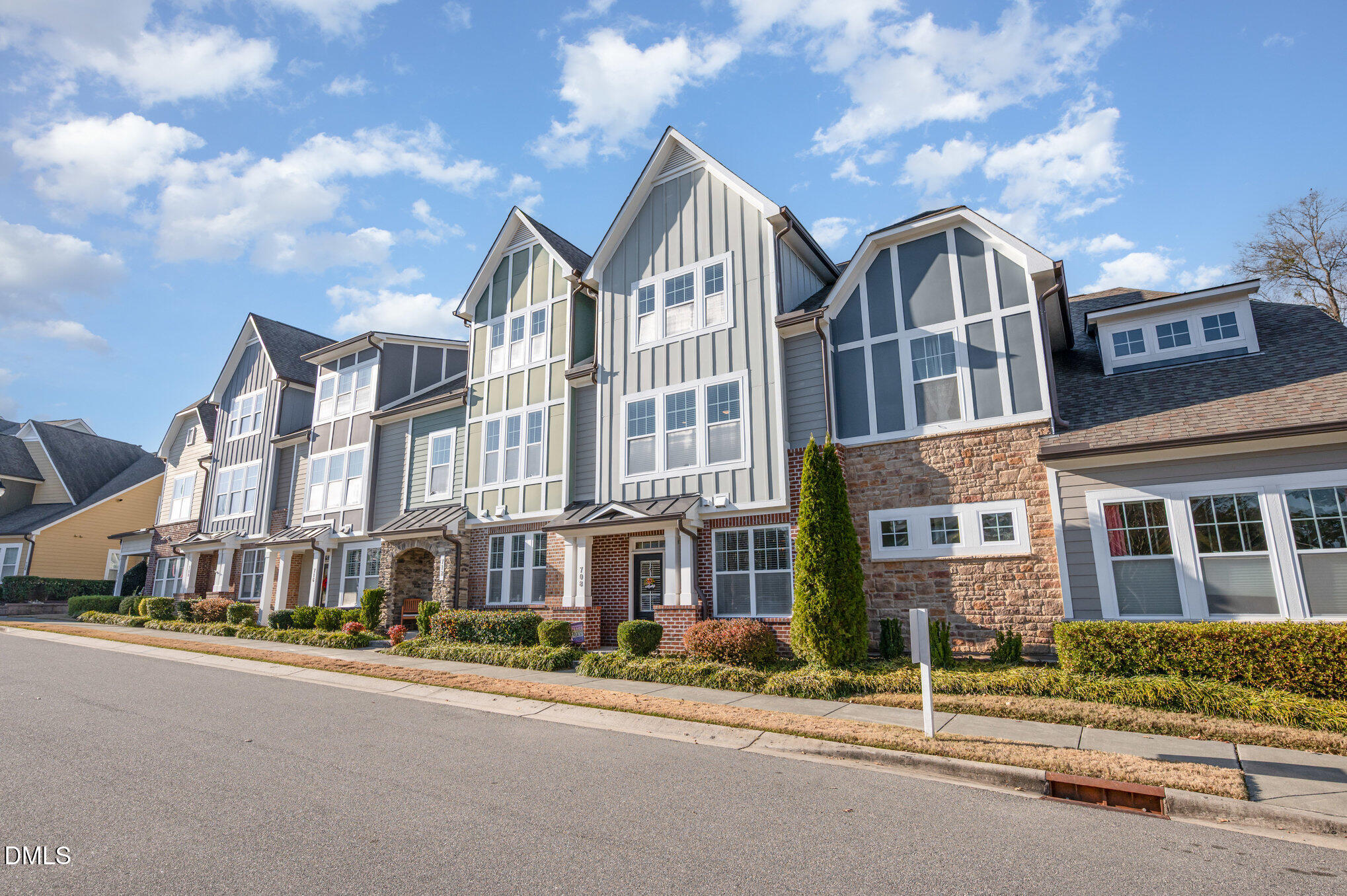 708 Fallon Grove Way Raleigh, NC 27608 - Photo 2 of 27 a front view of a building with a street
