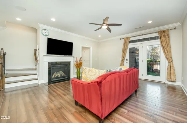 a living room with furniture fireplace and flat screen tv
