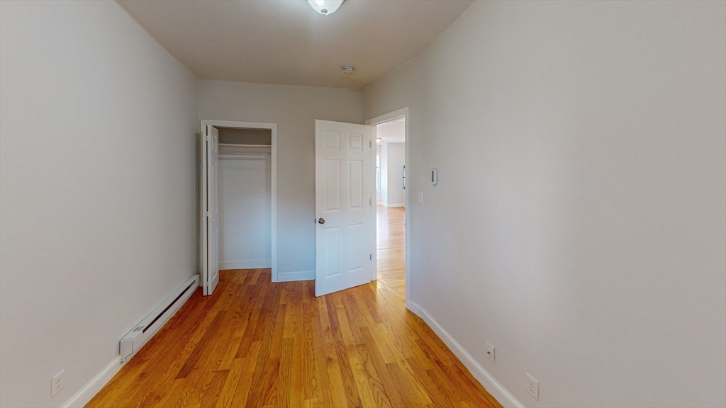 67 Marion Street, Unit 3 Boston, MA 02128 - Photo 12 of 16 a view of a room with wooden floor