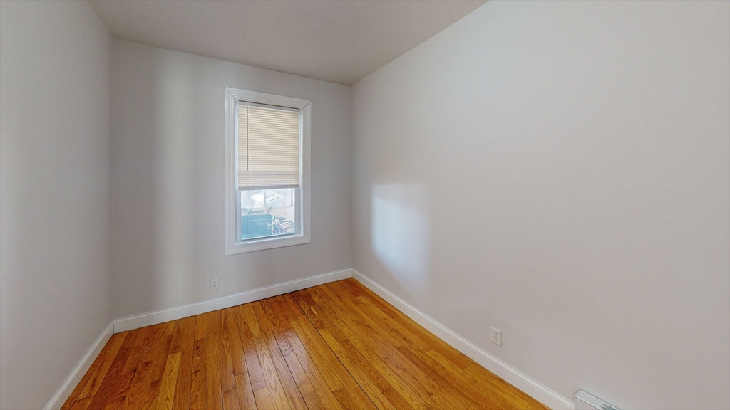 67 Marion Street, Unit 3 Boston, MA 02128 - Photo 13 of 16 a view of empty room with window