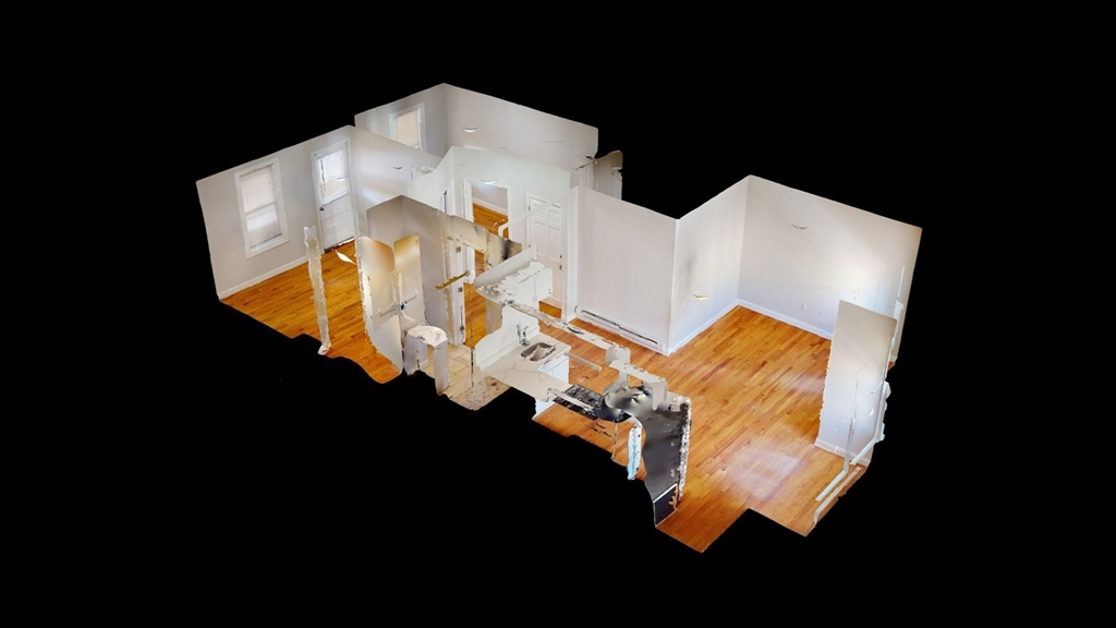 67 Marion Street, Unit 3 Boston, MA 02128 - Photo 15 of 16 a view of water heater room with wooden floor