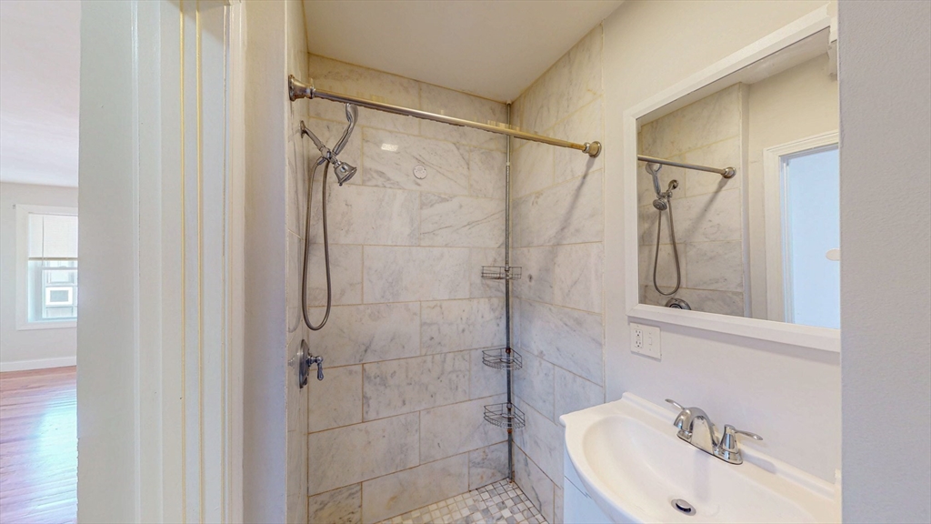 67 Marion Street, Unit 3 Boston, MA 02128 - Photo 8 of 16 a bathroom with a sink and shower