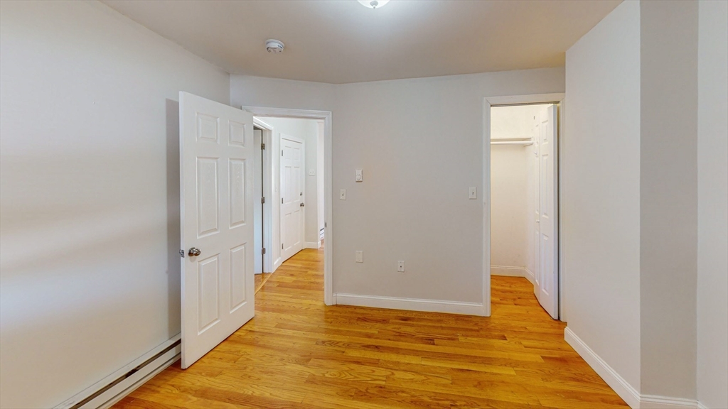 67 Marion Street, Unit 3 Boston, MA 02128 - Photo 10 of 16 a view of a hallway with wooden floor
