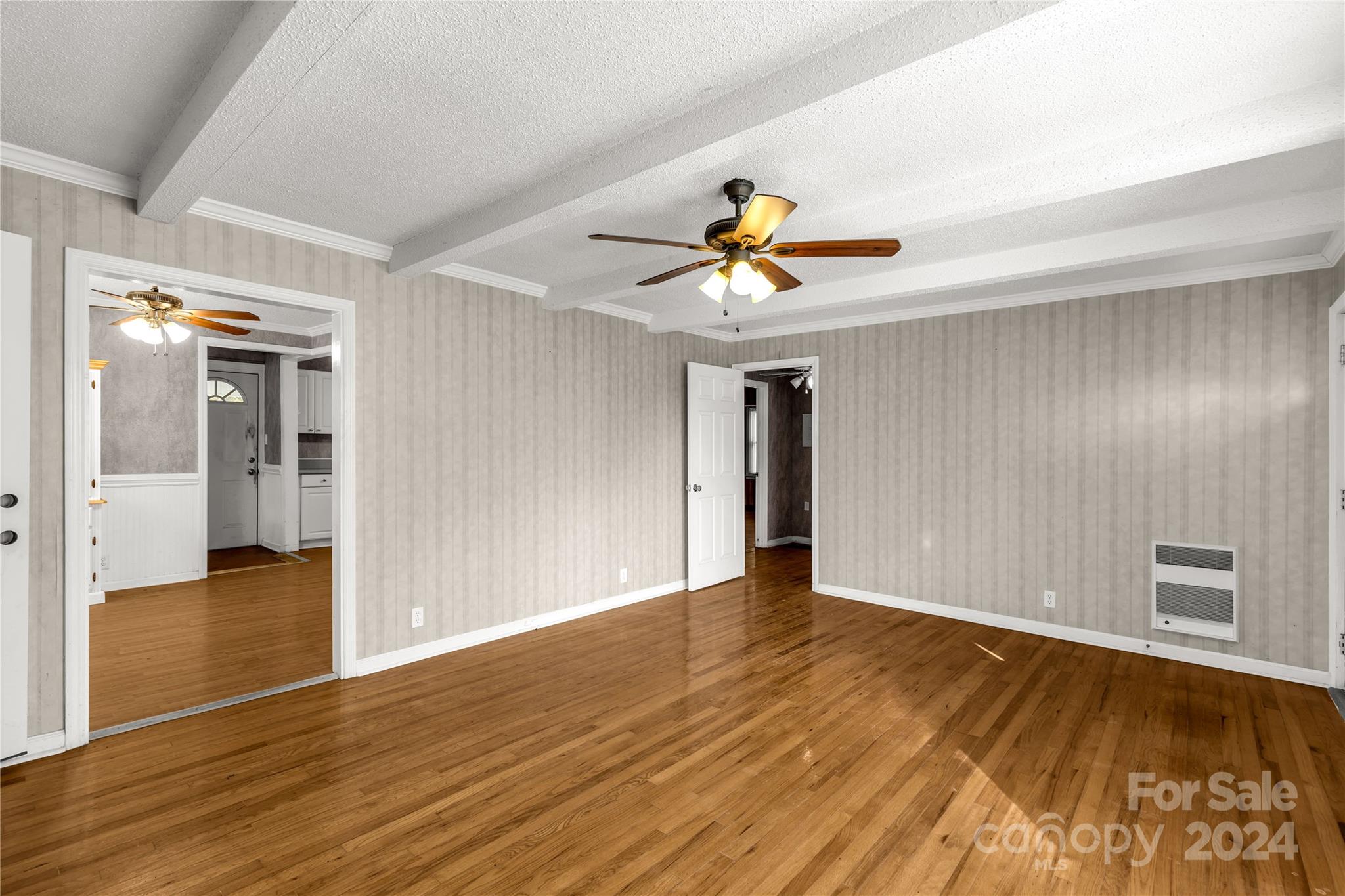 813 Potter Road Lancaster, SC 29720 - Photo 10 of 39 a view of an empty room with wooden floor and a window