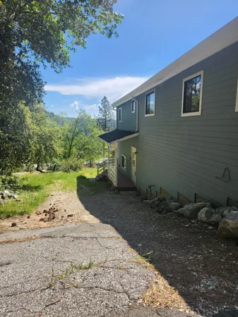 a front view of a house with parking