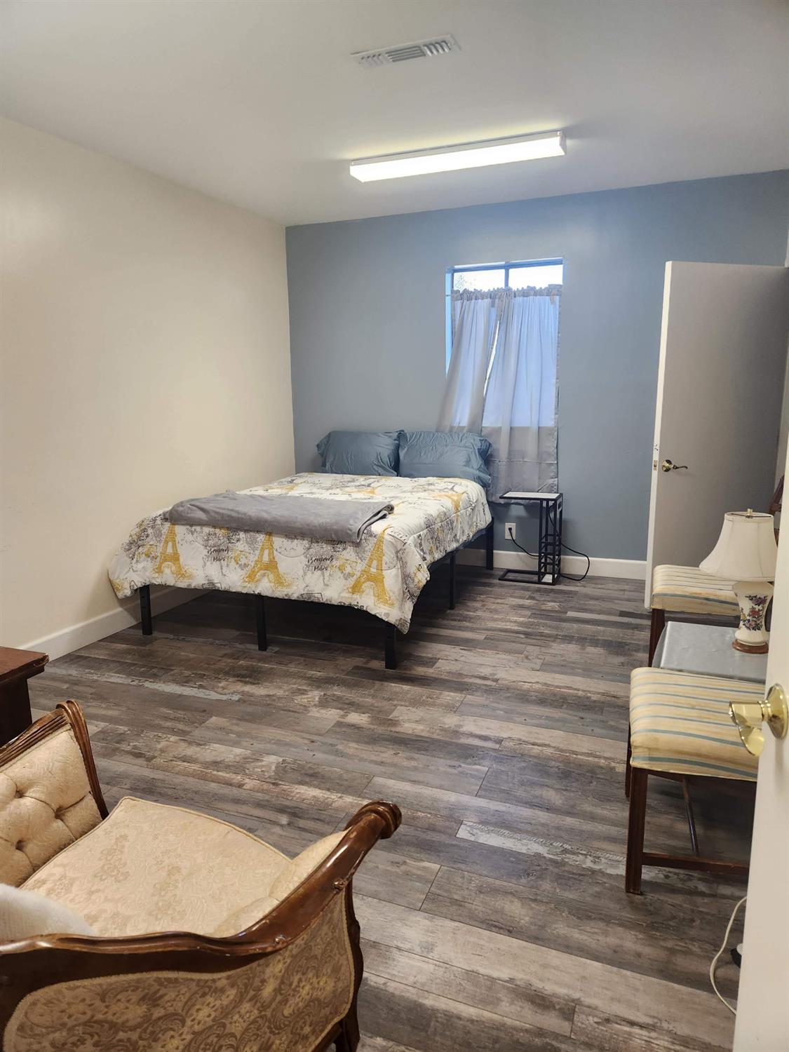 1333 Highway 174 Colfax, CA 95713 - Photo 86 of 88 a bedroom with a bed and wooden floor