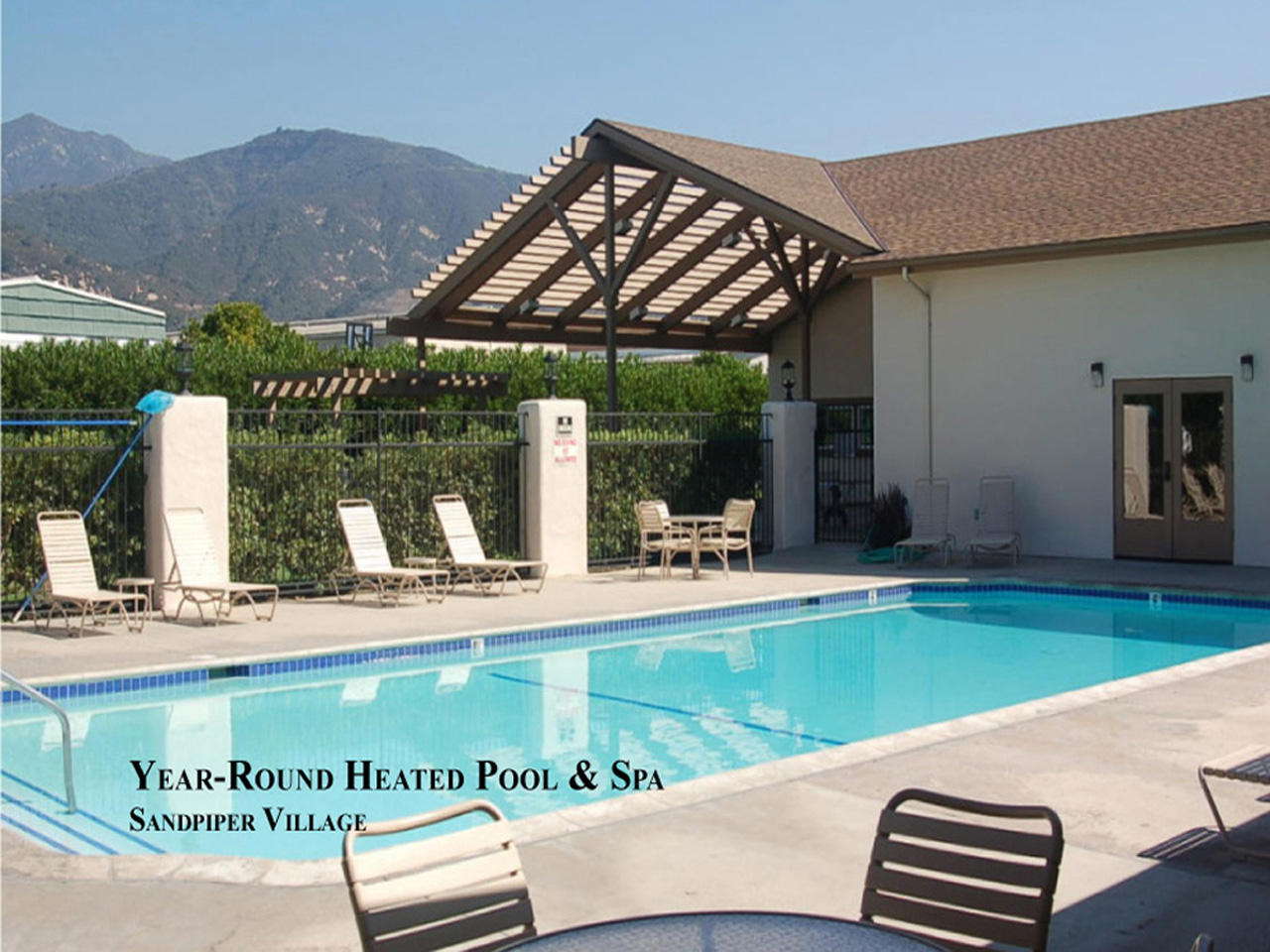 3950 Via Real, Unit SPC 256 Carpinteria, CA 93013 - Photo 12 of 25 a view of a swimming pool with a patio and a yard