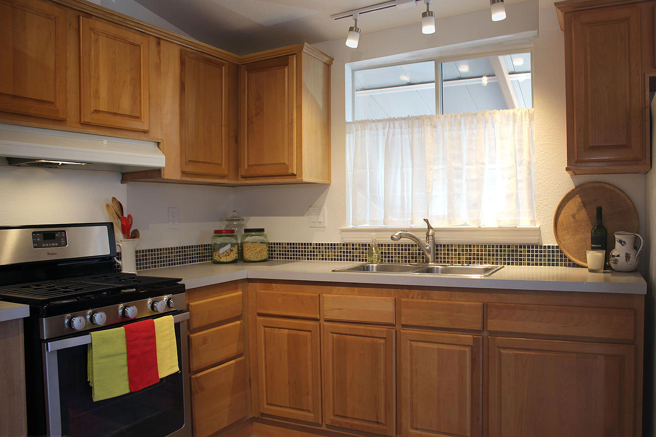 3950 Via Real, Unit SPC 256 Carpinteria, CA 93013 - Photo 3 of 25 a kitchen with stainless steel appliances granite countertop a sink stove and cabinets