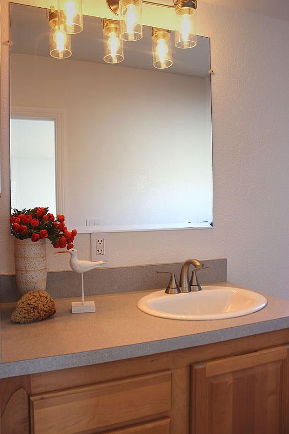 3950 Via Real, Unit SPC 256 Carpinteria, CA 93013 - Photo 6 of 25 a bathroom with a sink and a mirror