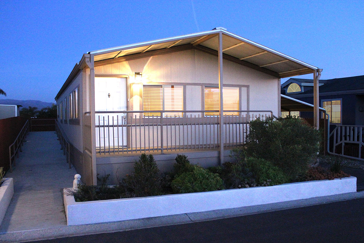 3950 Via Real, Unit SPC 256 Carpinteria, CA 93013 - Photo 10 of 25 a view of a house with a small yard and plants