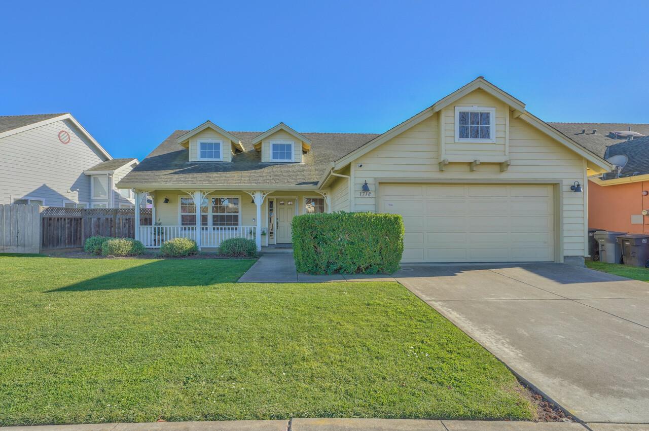 1718 Beacon Hill Drive Salinas, CA 93906 - Photo 1 of 27 a front view of a house with a yard and garage