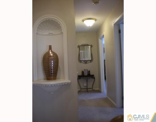 33 Clive Hills Road Edison, NJ 08820 - Photo 6 of 10 a living room with furniture and a painting