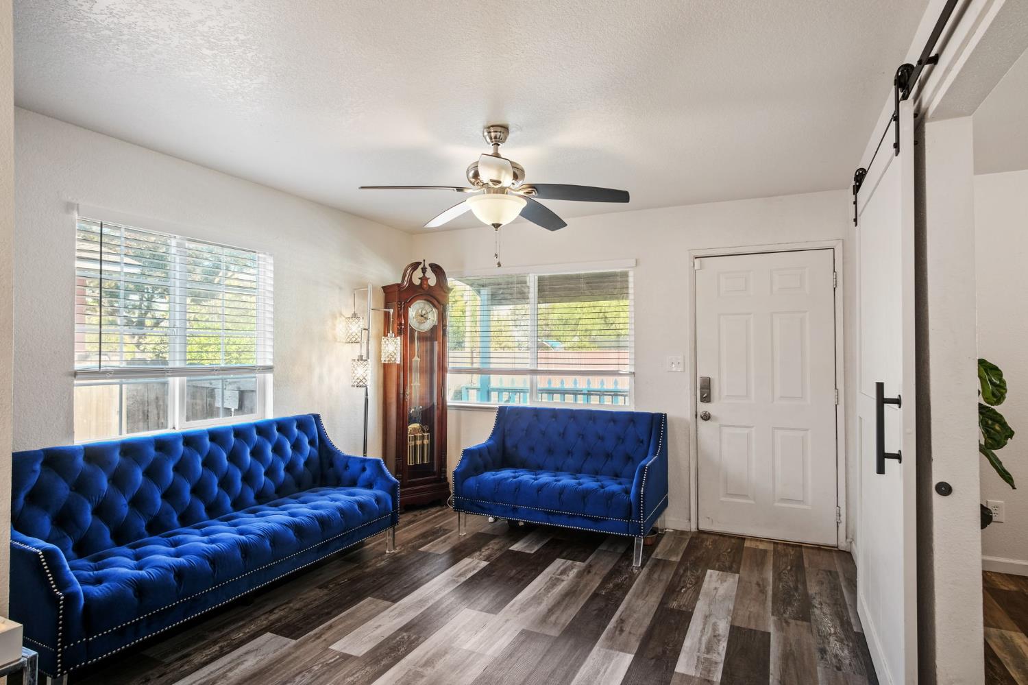 1220 Fig Avenue Merced, CA 95341 - Photo 3 of 17 a living room with a couch and a chandelier