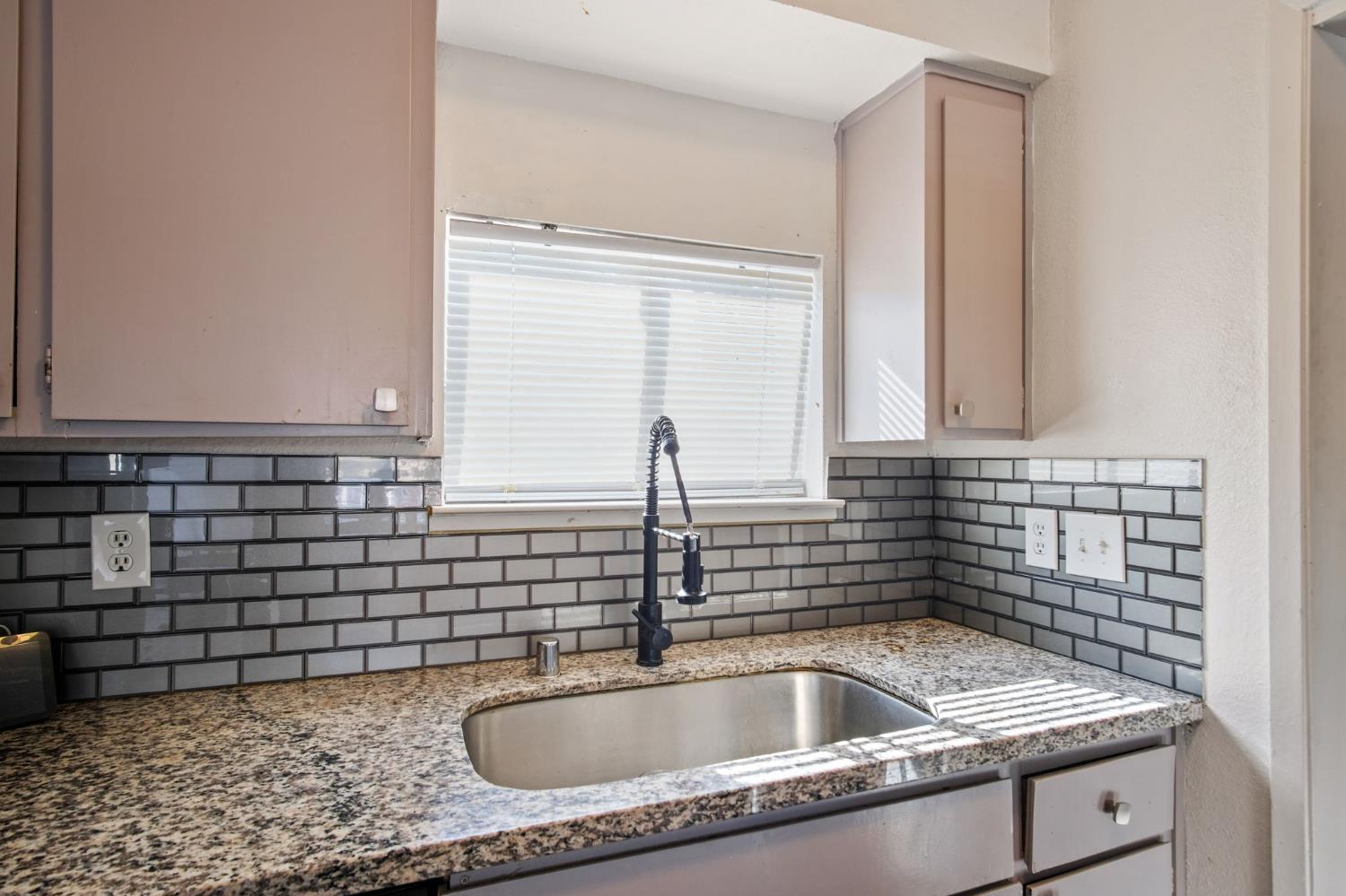 1220 Fig Avenue Merced, CA 95341 - Photo 7 of 17 a close view of sink and mirror