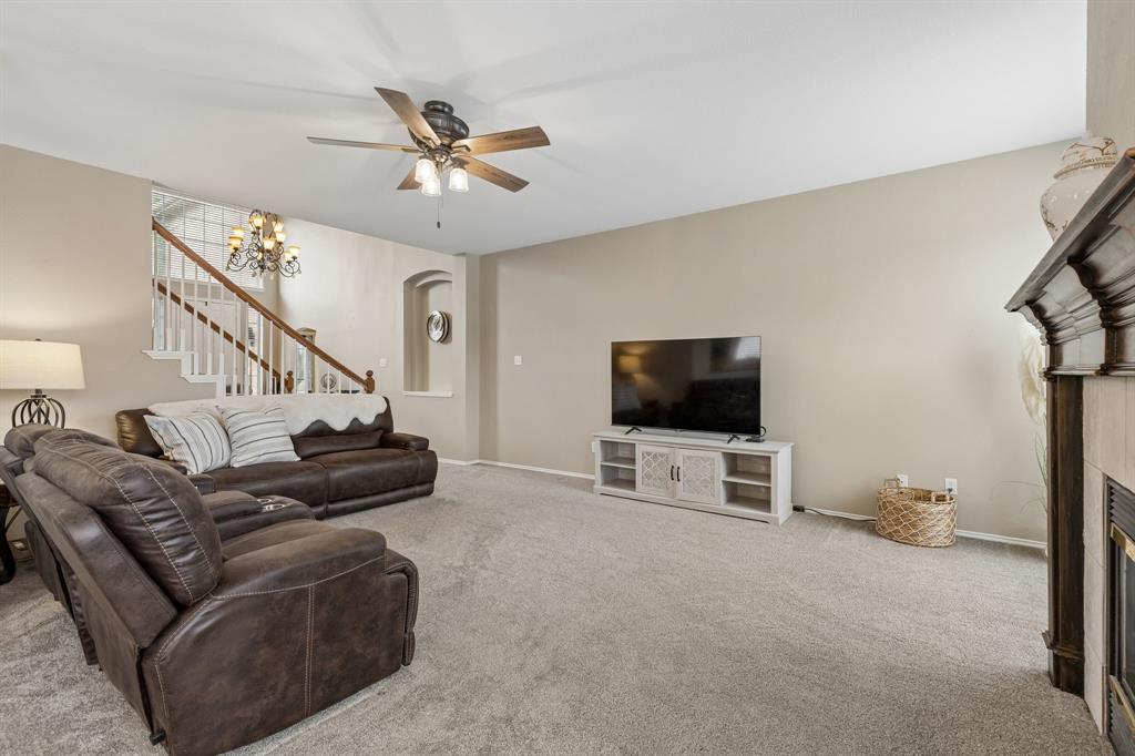 129 Timberbluff Lane Murphy, TX 75094 - Photo 13 of 34 a living room with furniture and a flat screen tv