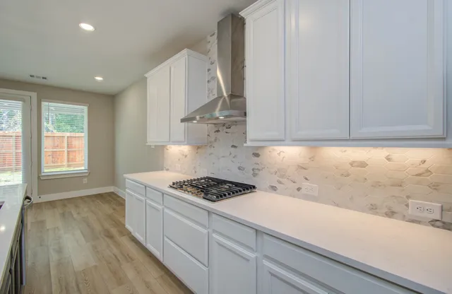 a kitchen with a refrigerator and a sink