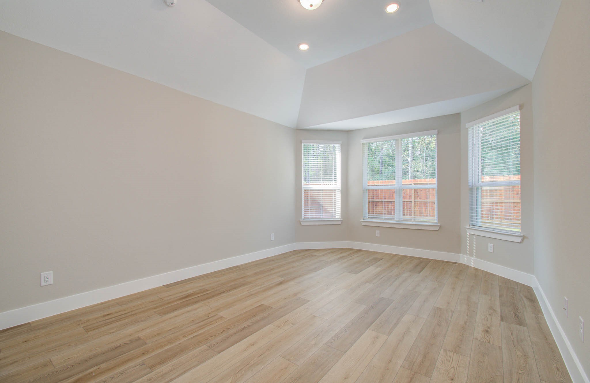 9950 Wild Indigo Circle Conroe, TX 77385 - Photo 20 of 50 wooden floor in an empty room with a window