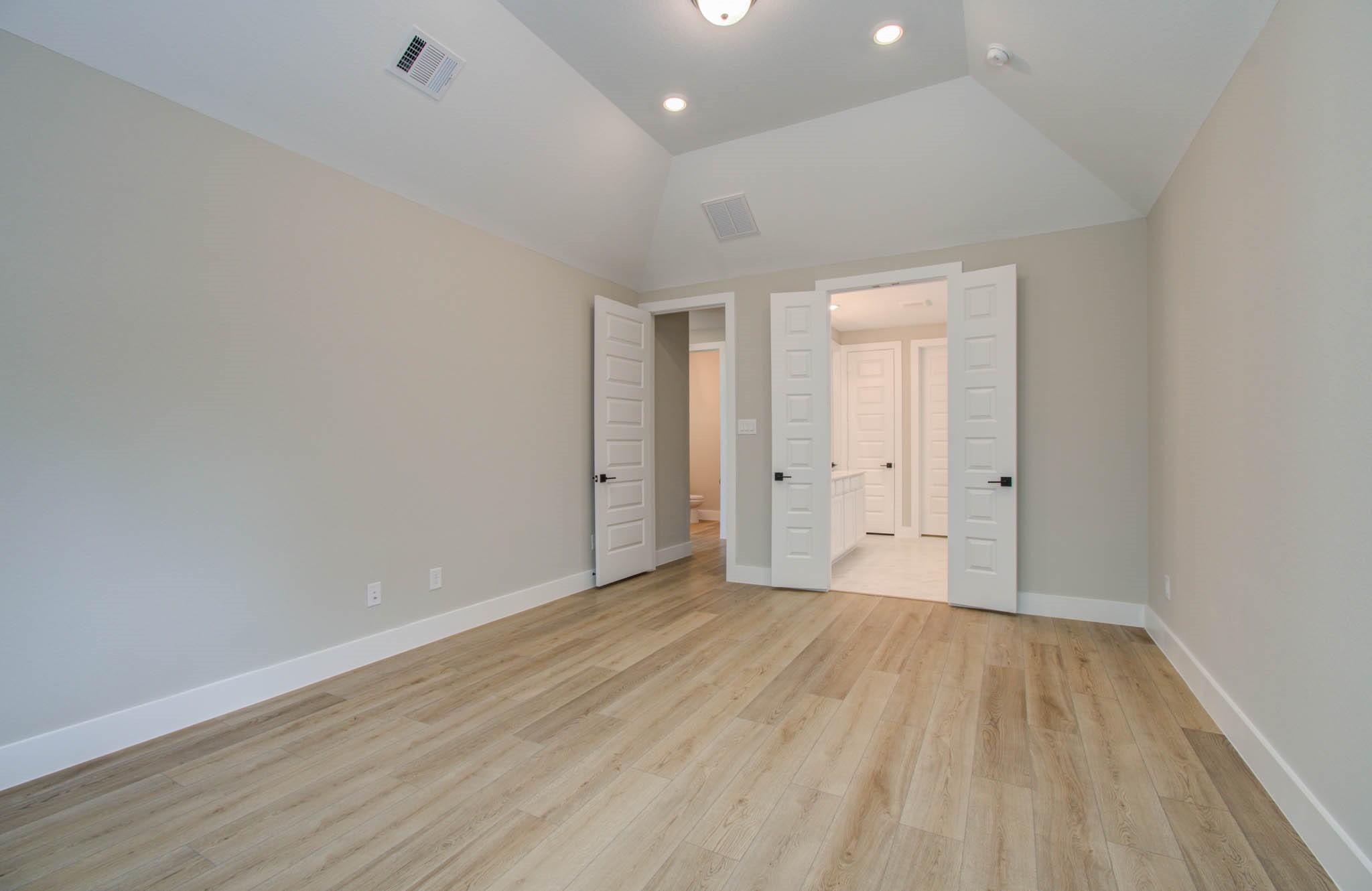 9950 Wild Indigo Circle Conroe, TX 77385 - Photo 22 of 50 wooden floor in an empty room with a window