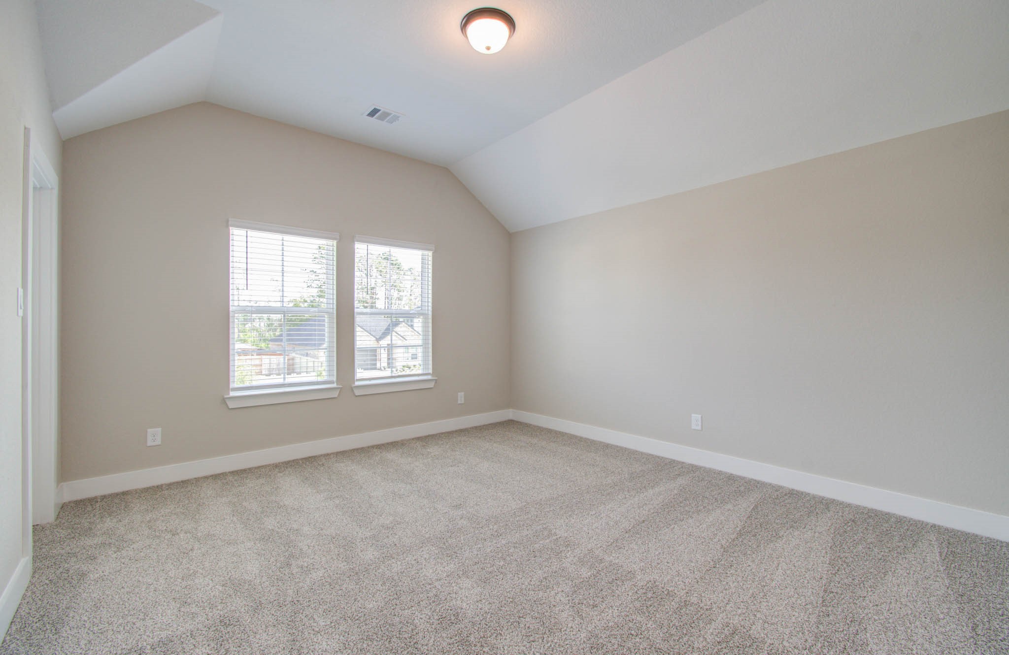 9950 Wild Indigo Circle Conroe, TX 77385 - Photo 33 of 50 an empty room with a window