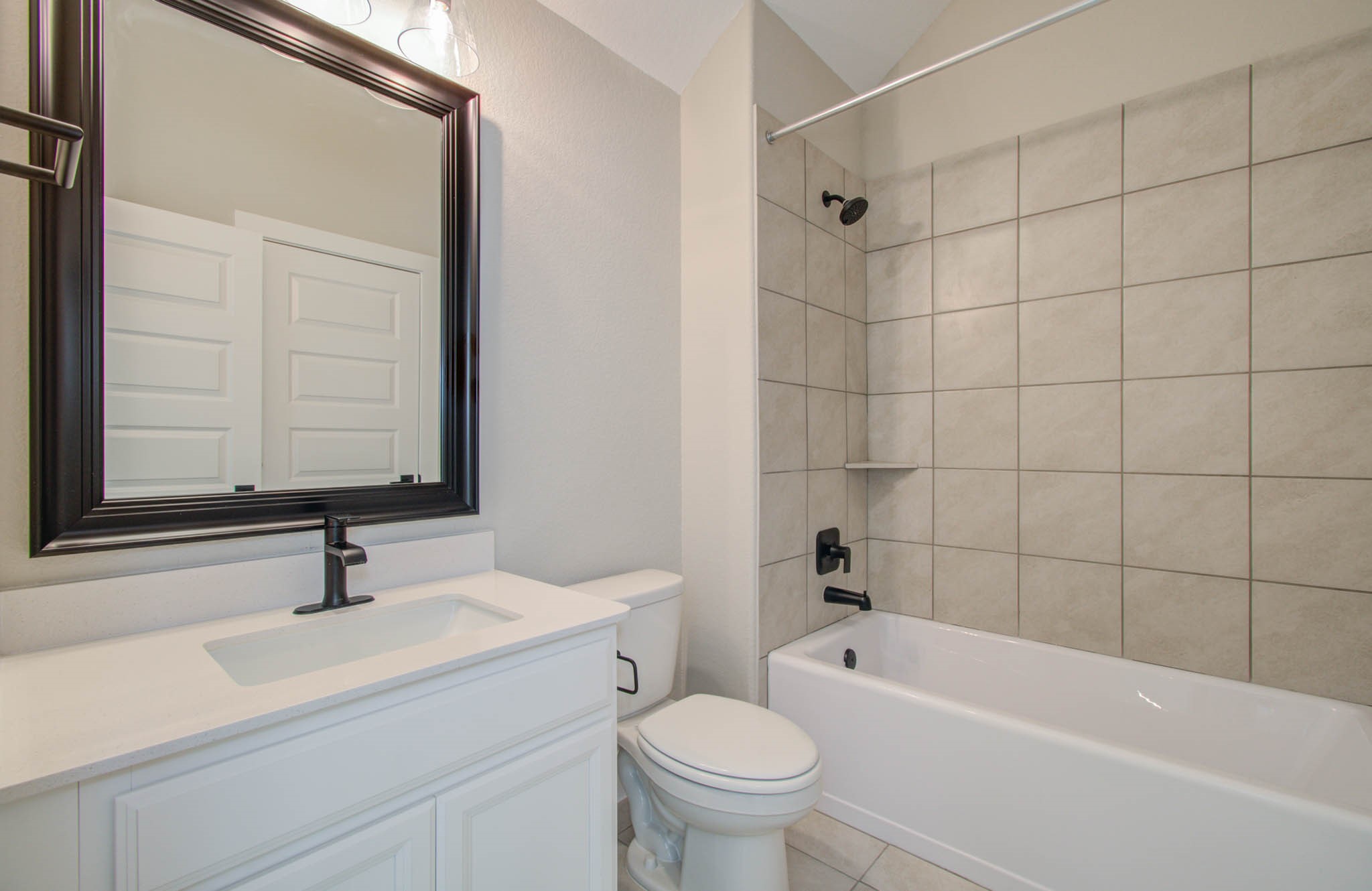 9950 Wild Indigo Circle Conroe, TX 77385 - Photo 35 of 50 a bathroom with a sink a toilet and shower