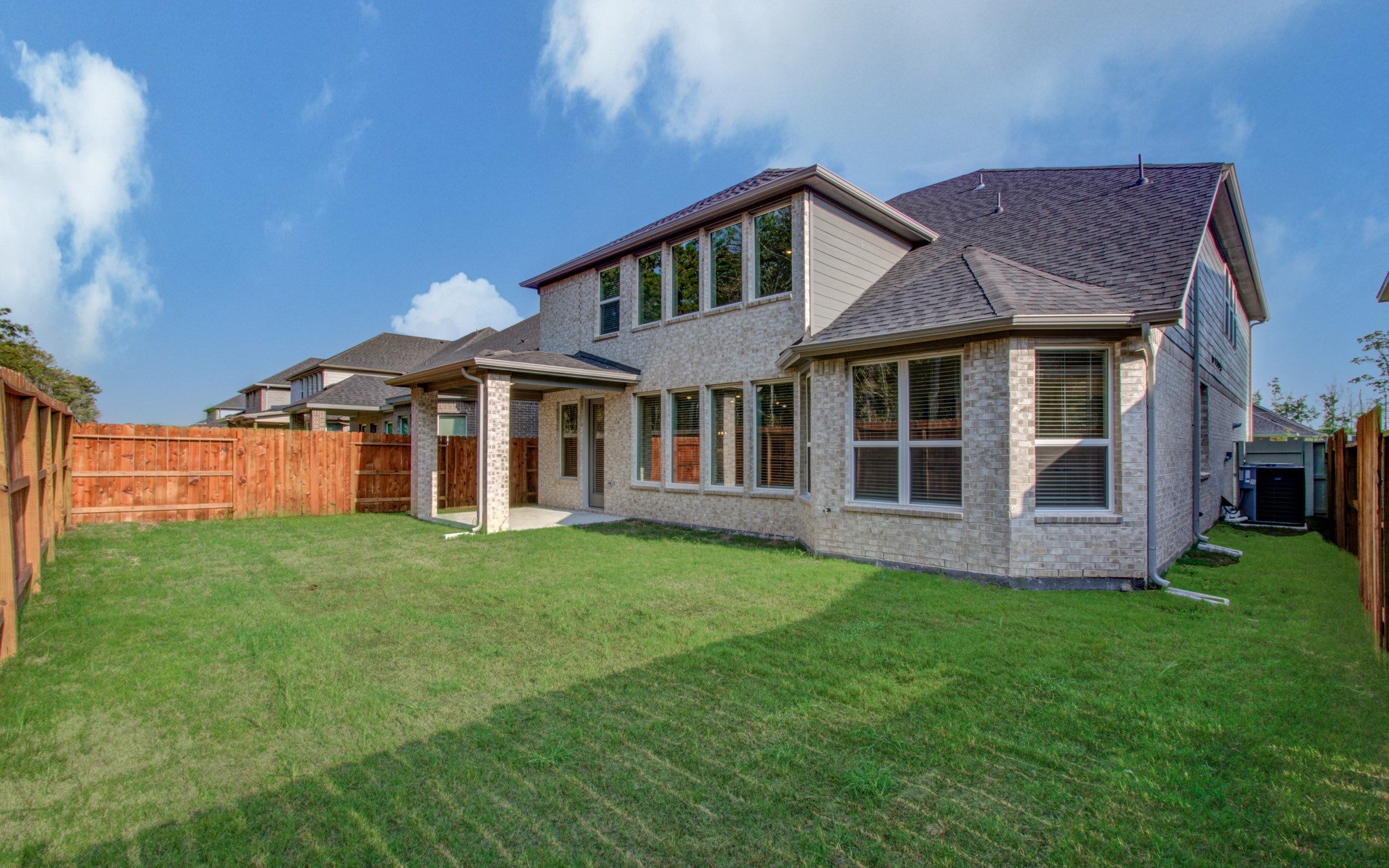 9950 Wild Indigo Circle Conroe, TX 77385 - Photo 40 of 50 a view of a house with a yard and sitting area