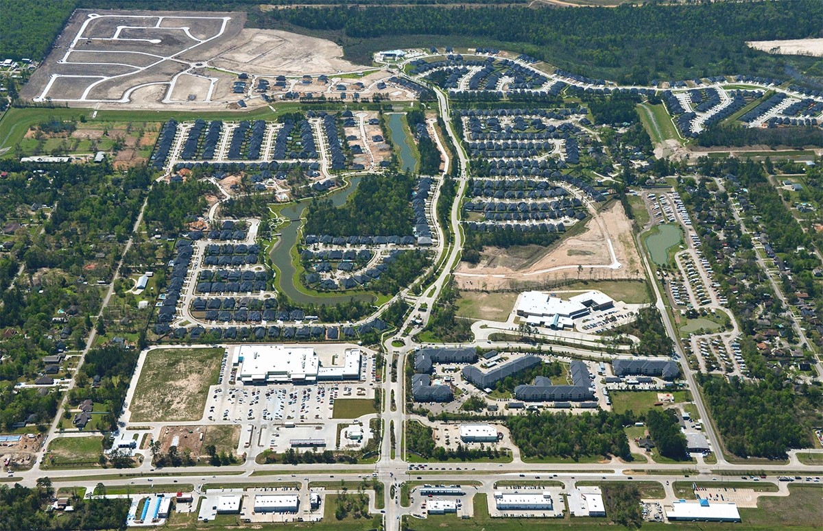 9950 Wild Indigo Circle Conroe, TX 77385 - Photo 46 of 50 a view of a city with tall buildings