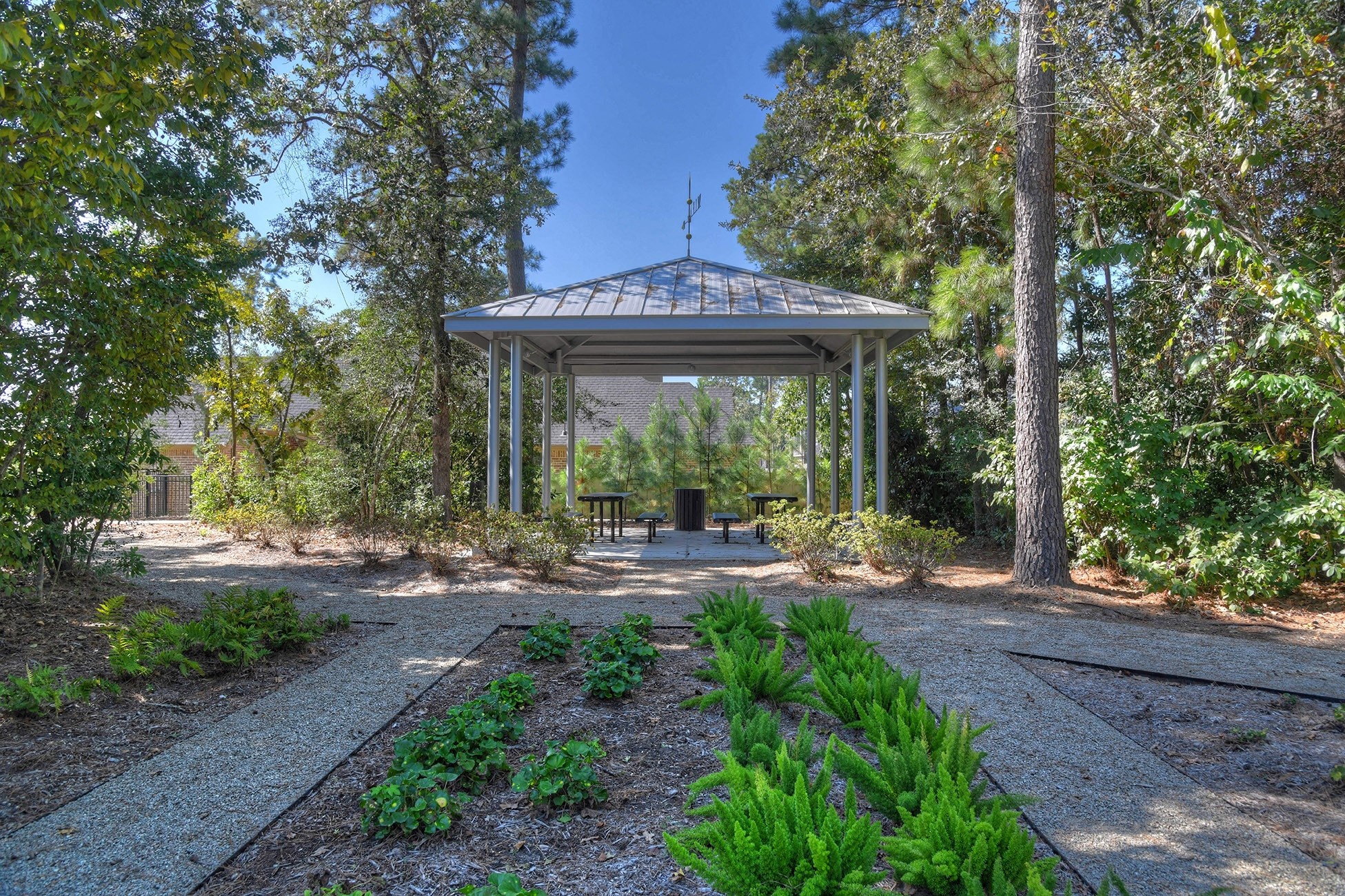 9950 Wild Indigo Circle Conroe, TX 77385 - Photo 48 of 50 a view of a house with backyard and sitting area
