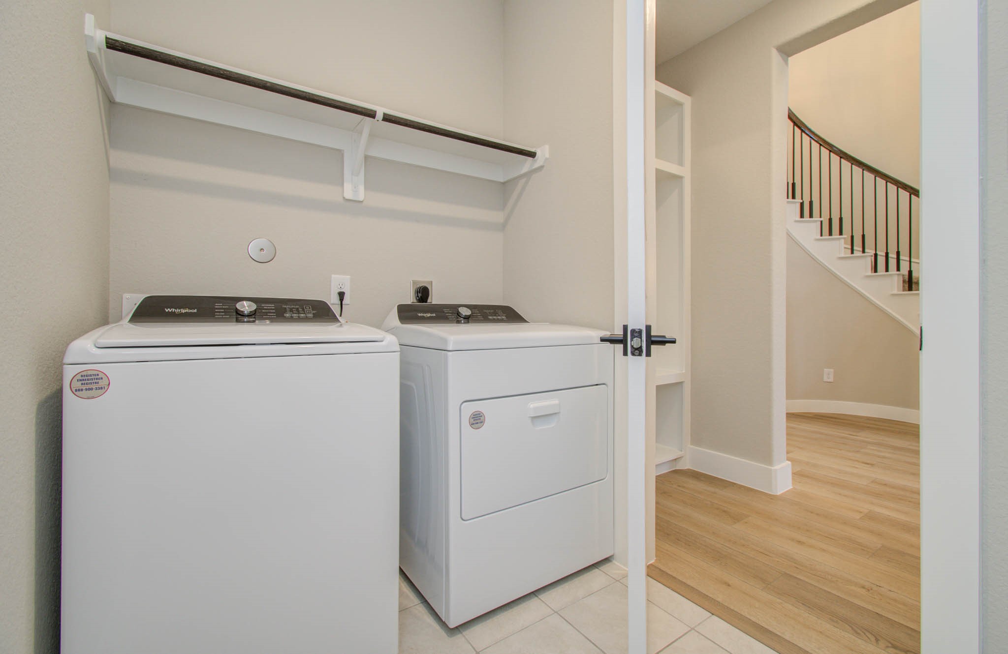 9950 Wild Indigo Circle Conroe, TX 77385 - Photo 9 of 50 a utility room with dryer and washer